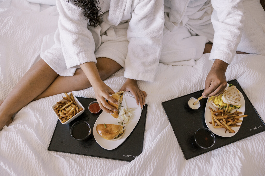 Staycation Couple Eating in a Hotel Room