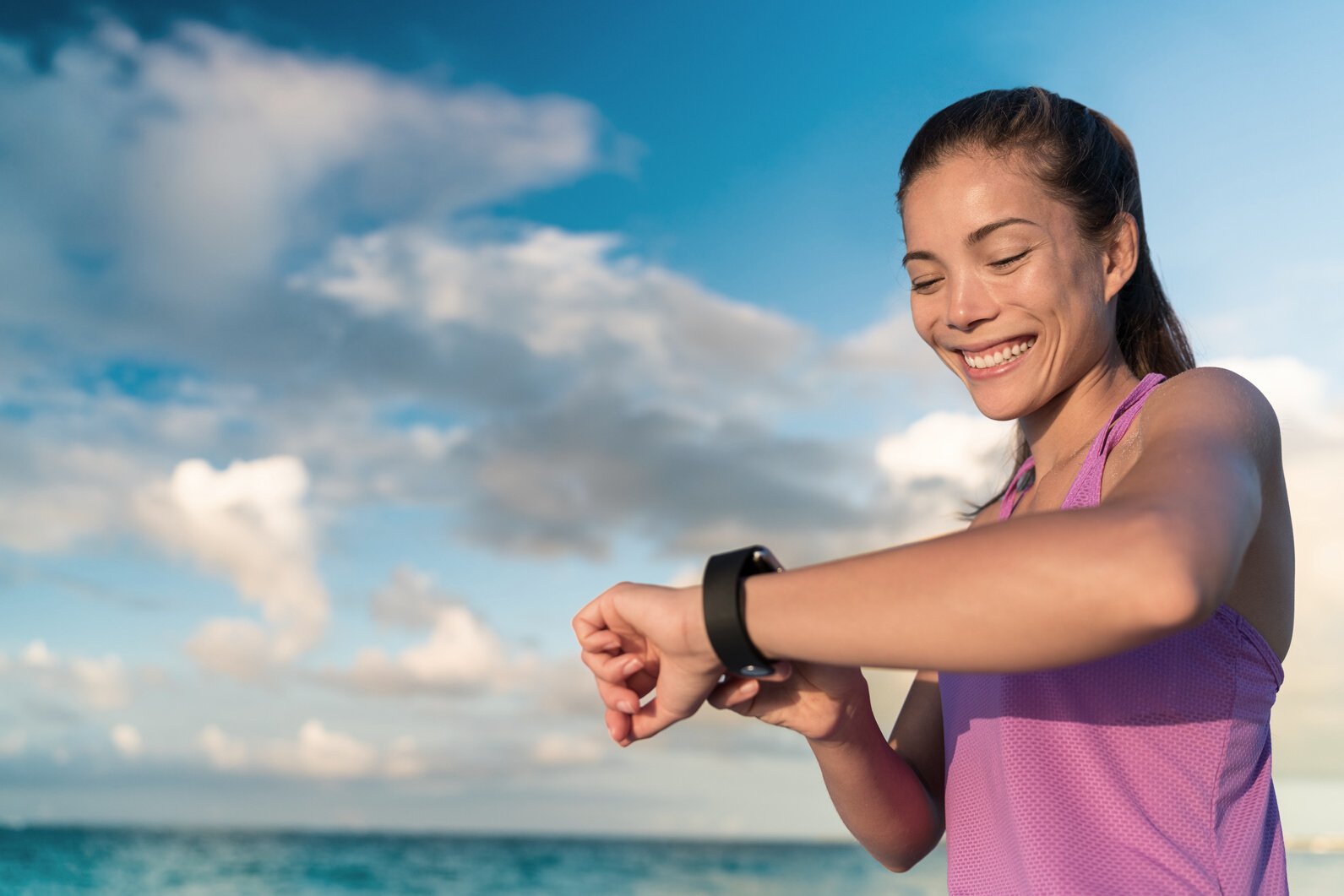 Active Asian Girl Using Fitness Tracker Smart Watch